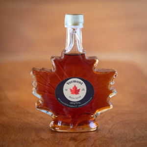 Pure maple syrup in a leaf shaped bottle.