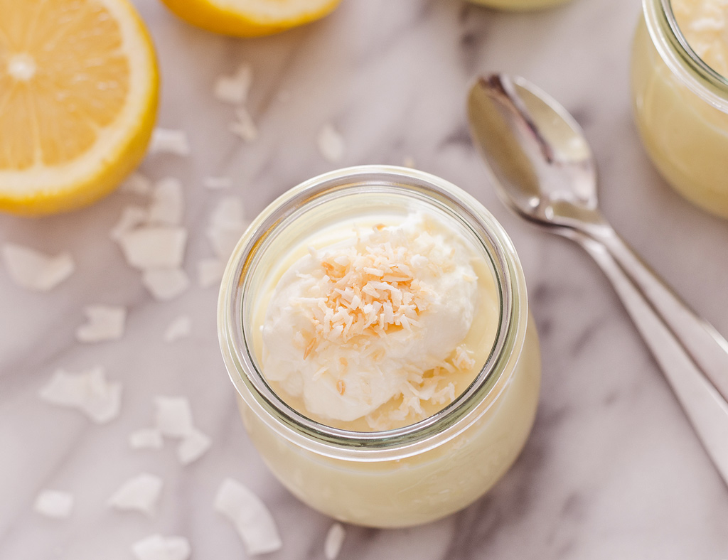 A beautiful Exotic Maple Pudding in a small glass jar garnish with coconut.