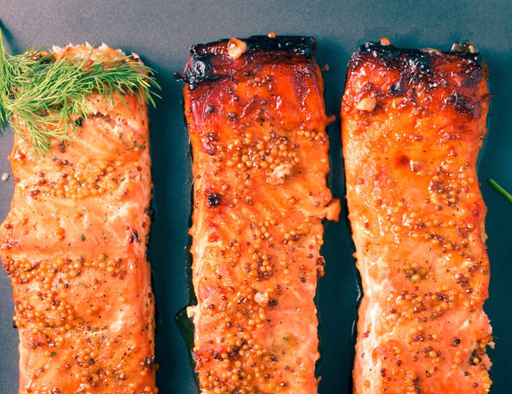 Three pieces of Maple-Mustard Glazed Salmon.