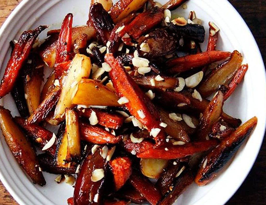 White bowl filled with Roasted Maple Vegetables.