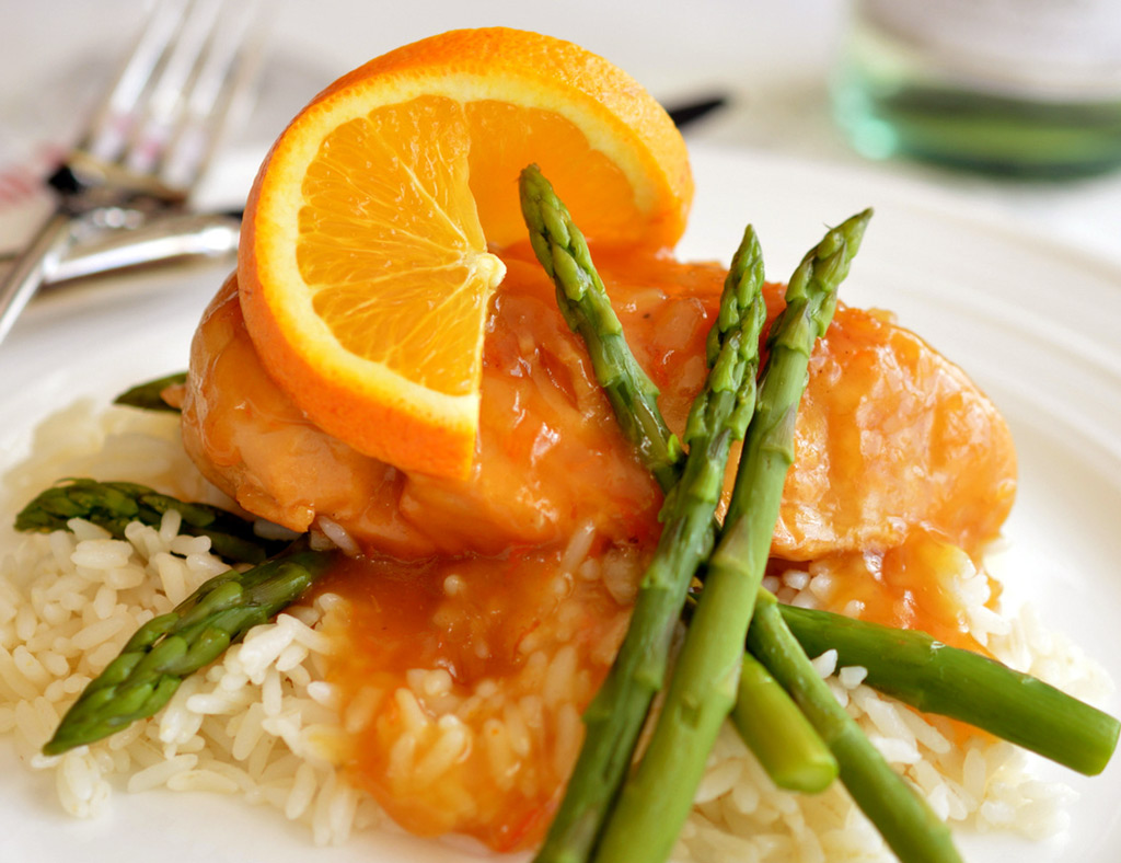 Maple Chicken with Oranges on cooked rice with asparagus.
