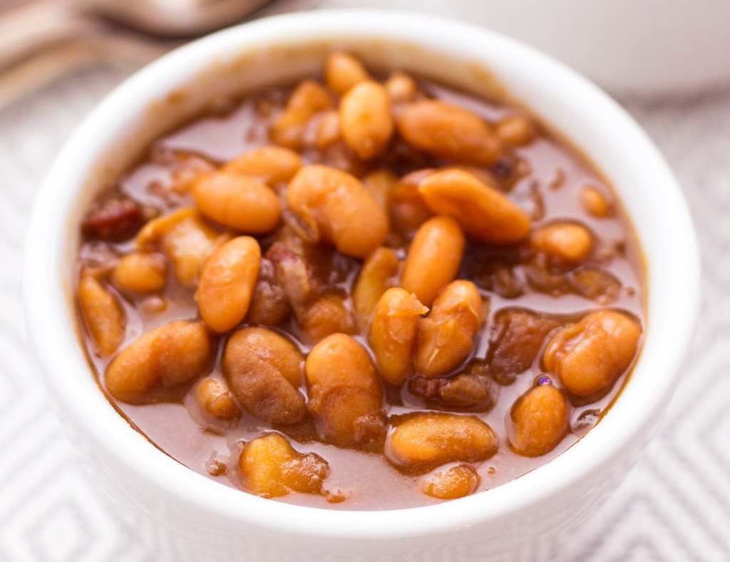 A white bowl filled with Smoky Beans.